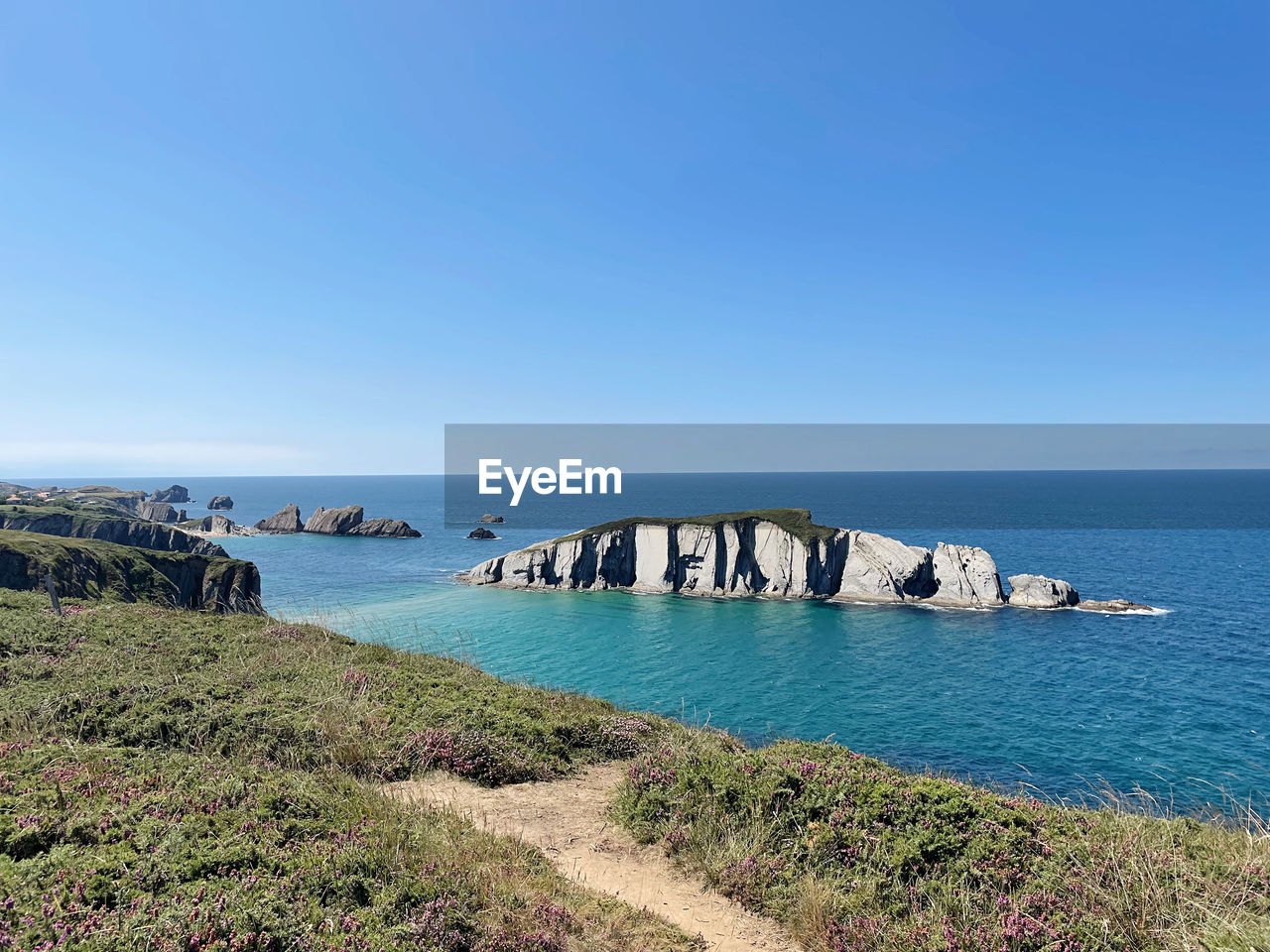 scenic view of sea against blue sky