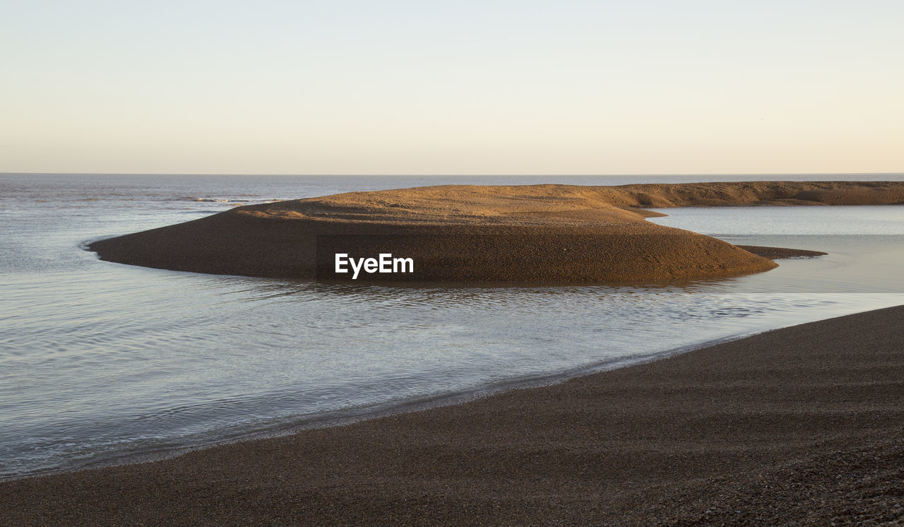 SEA SHORE AGAINST SKY