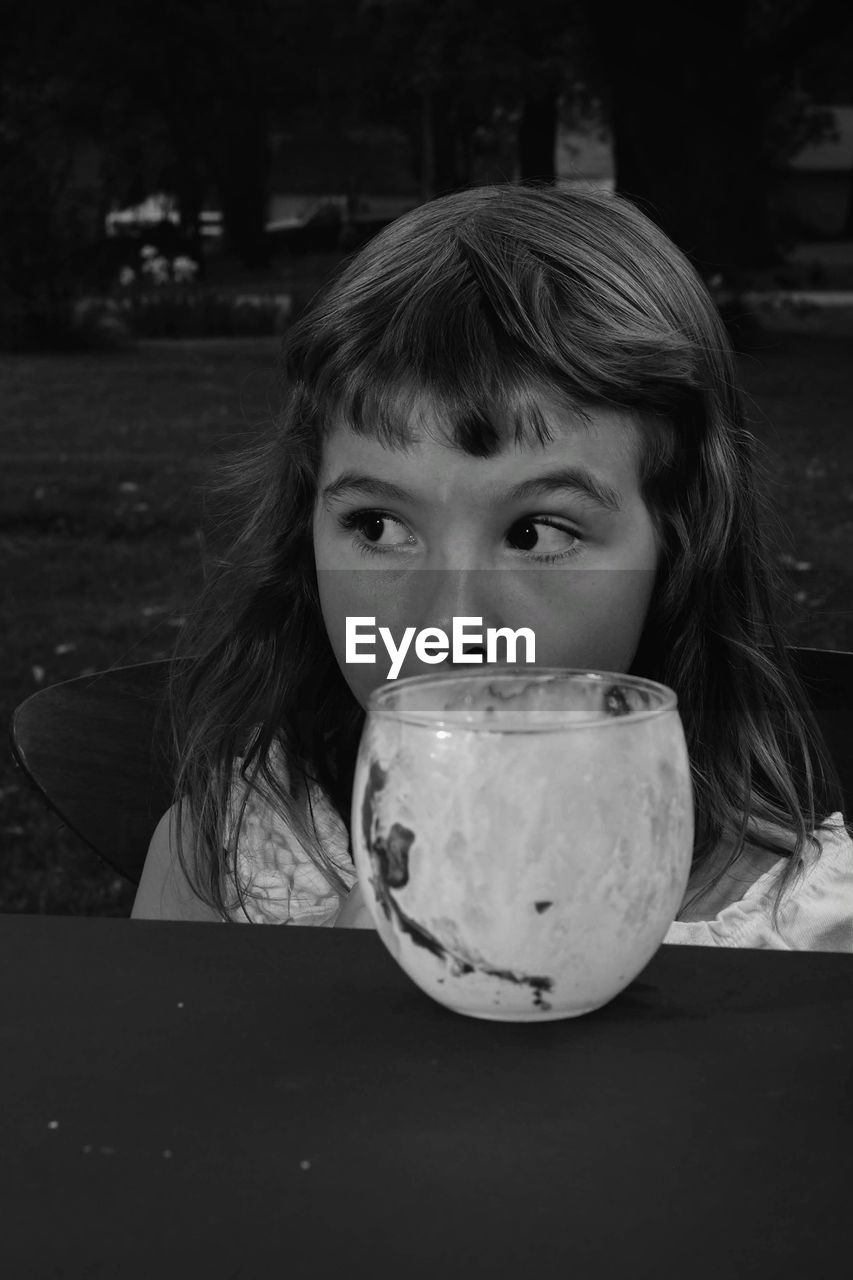 Girl with drink on table