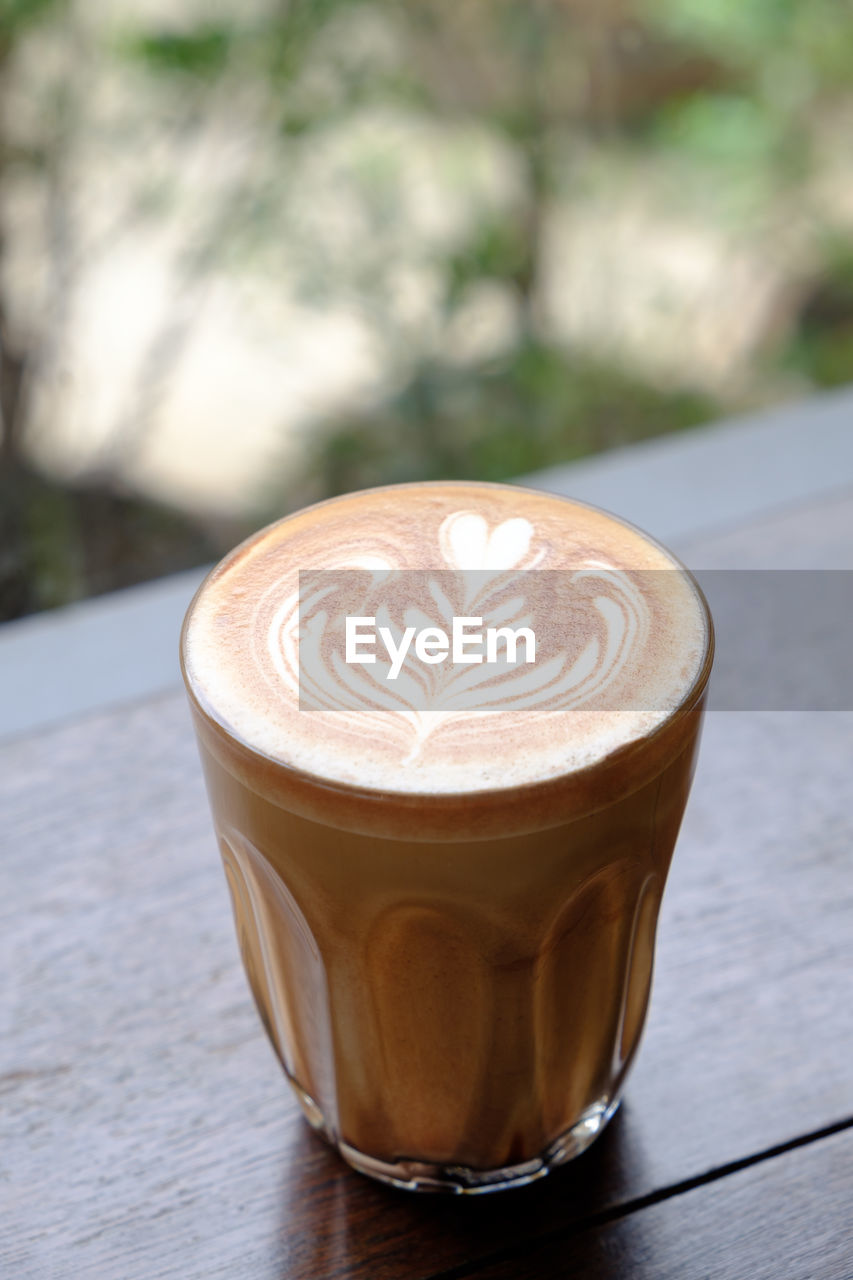 Close-up of cappuccino on table