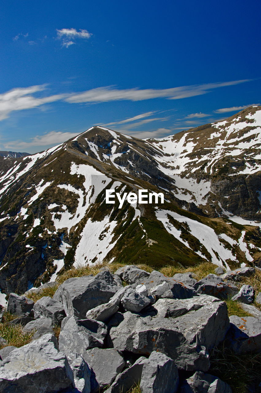 Scenic view of snowcapped mountains against sky