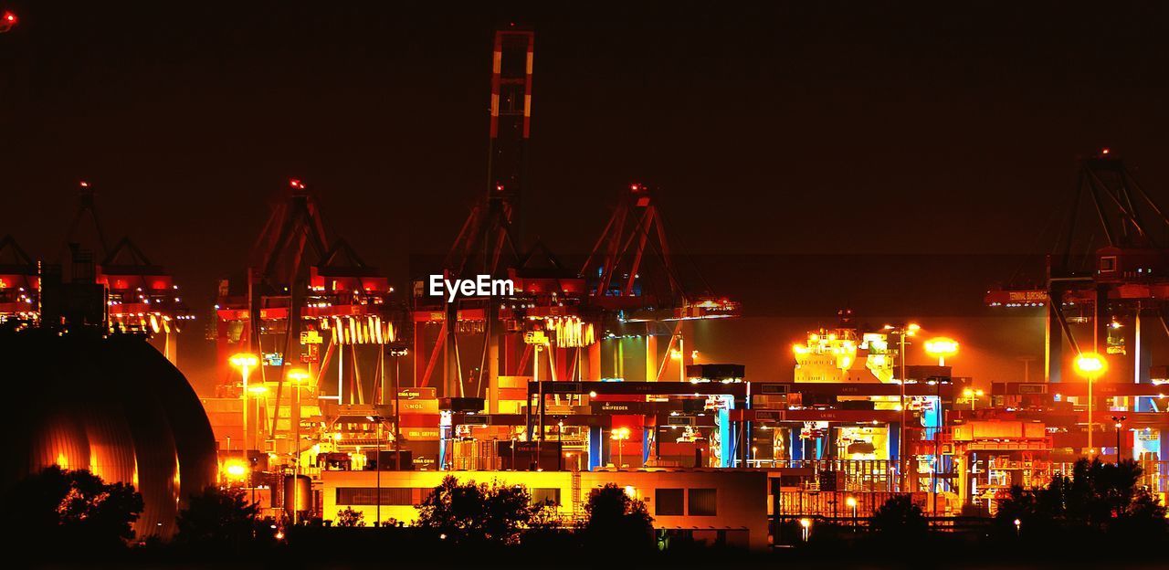 ILLUMINATED COMMERCIAL DOCK AT NIGHT
