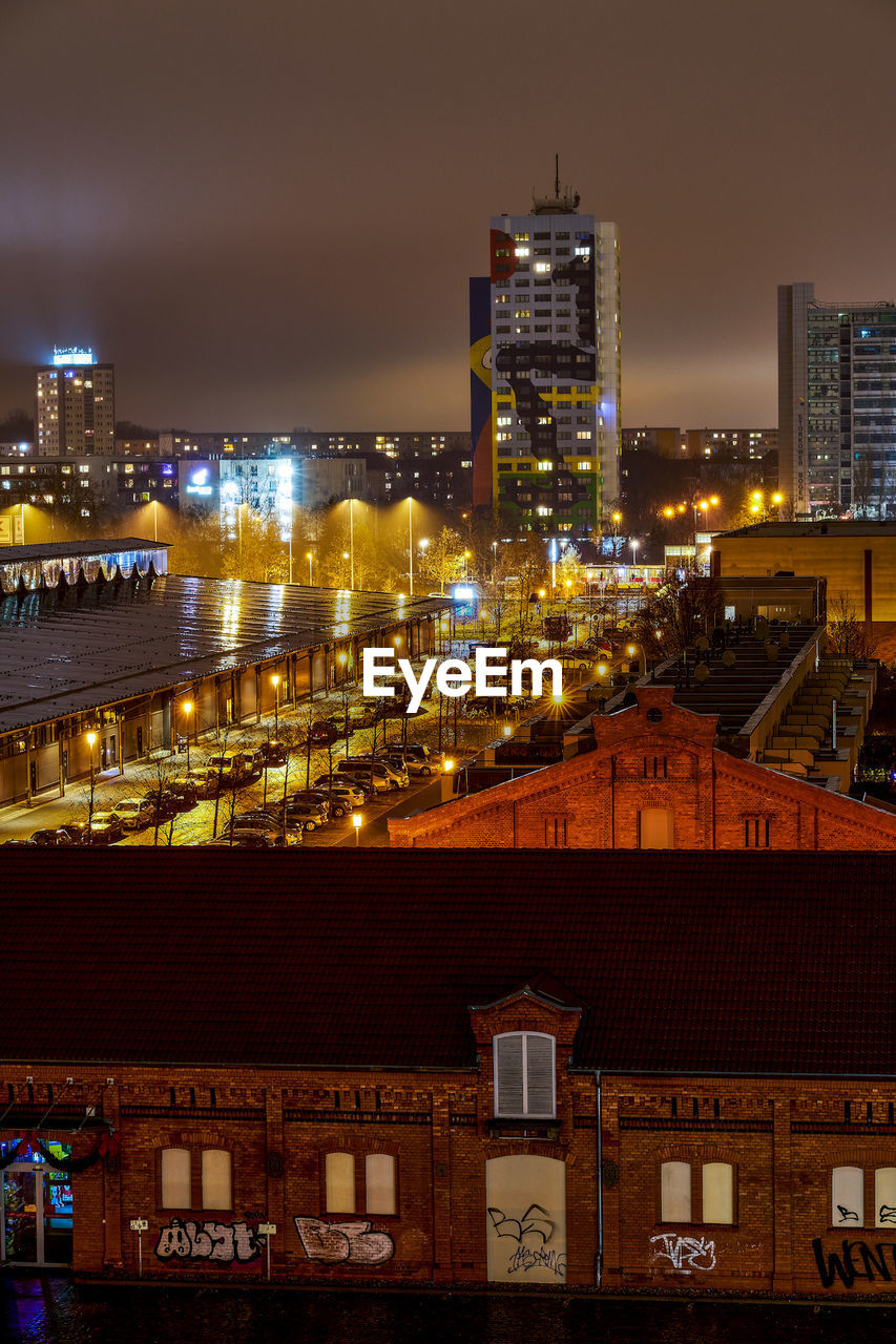 HIGH ANGLE VIEW OF BUILDINGS AT NIGHT