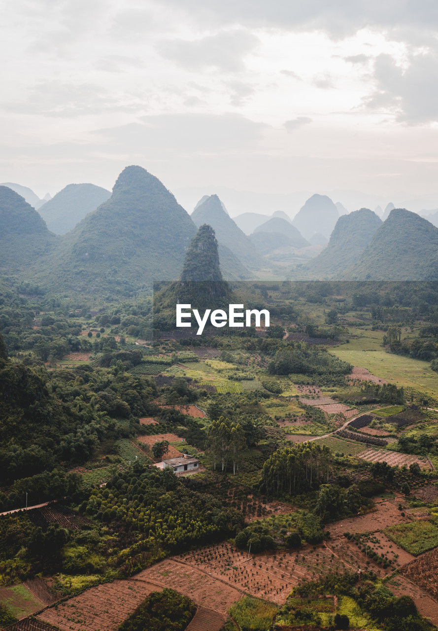 Mountains under cloudy sky at sunset, guilin, china