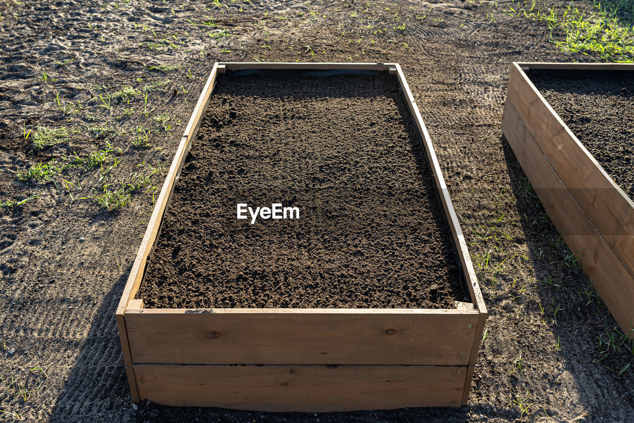 soil, garden, plant, nature, high angle view, day, no people, growth, agriculture, outdoors, sunlight, dirt, land, field, container