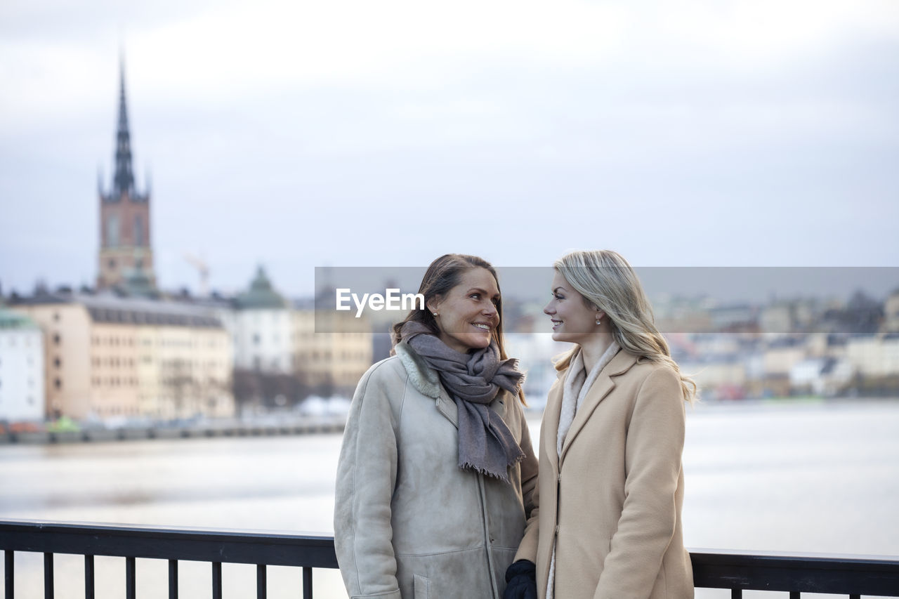 Mother with adult daughter in urban setting