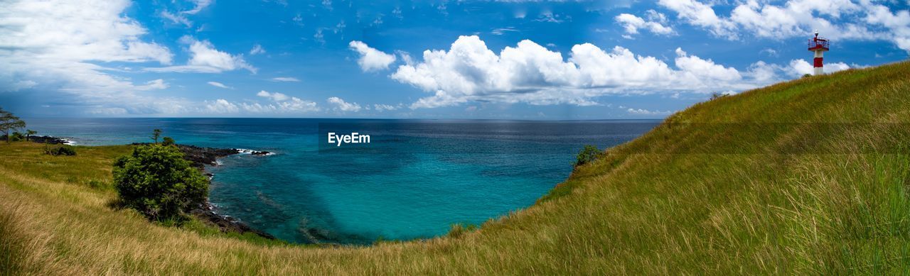 Panoramic view of sea against cloudy sky