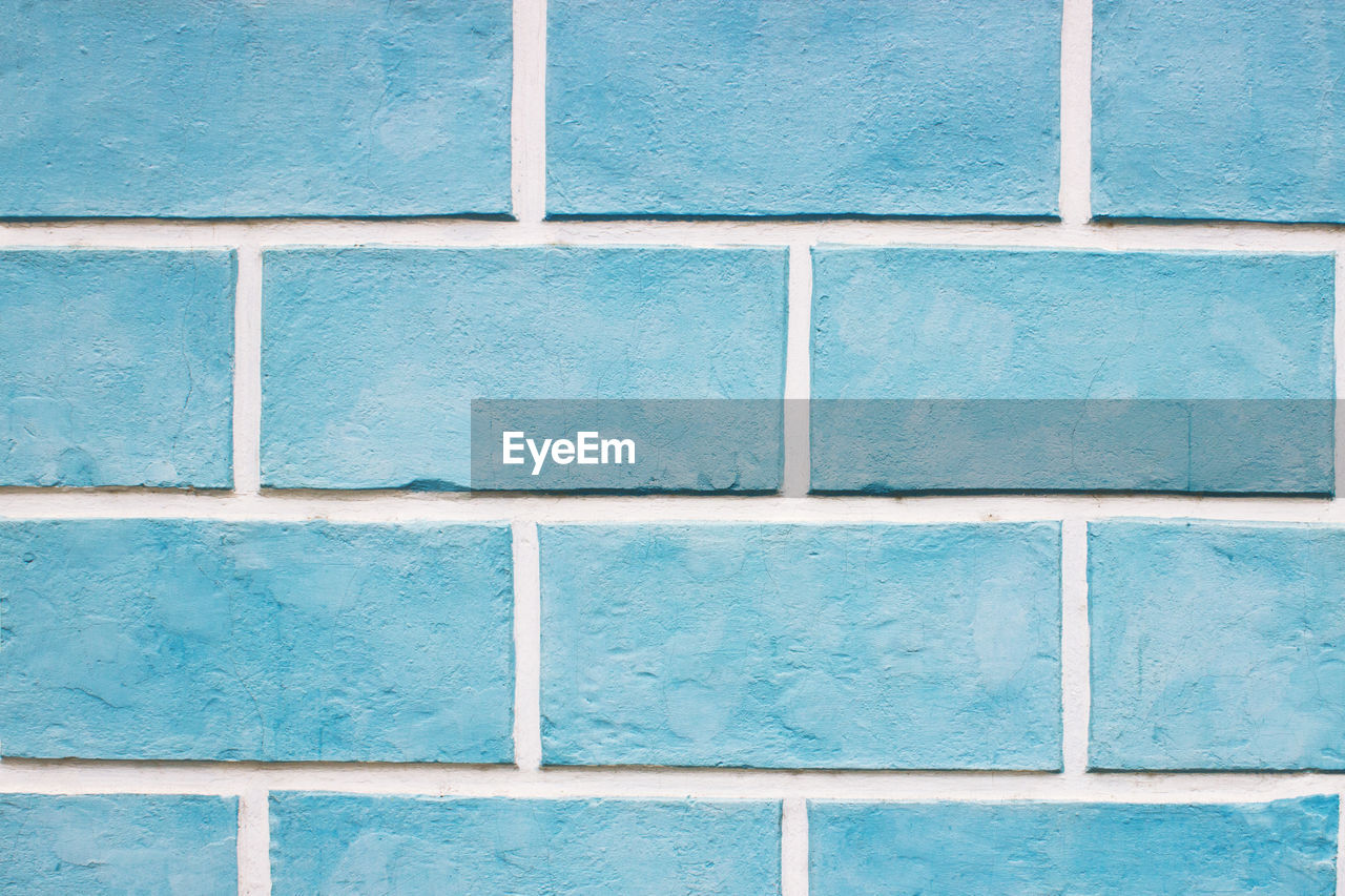 Textures on the blue wall, blue brick wall background.