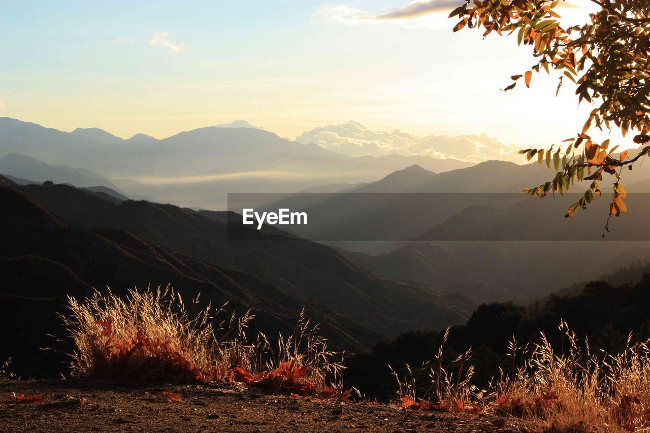 Scenic view of mountains against sky during sunset