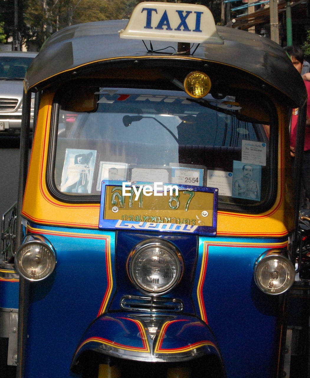 CLOSE-UP OF VINTAGE CAR ON BUS