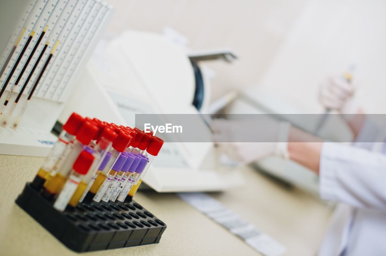 Close-up of test tube rack on table in laboratory