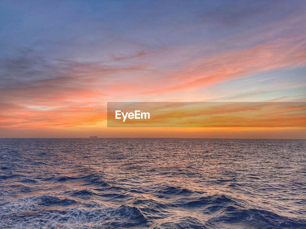 scenic view of sea against orange sky