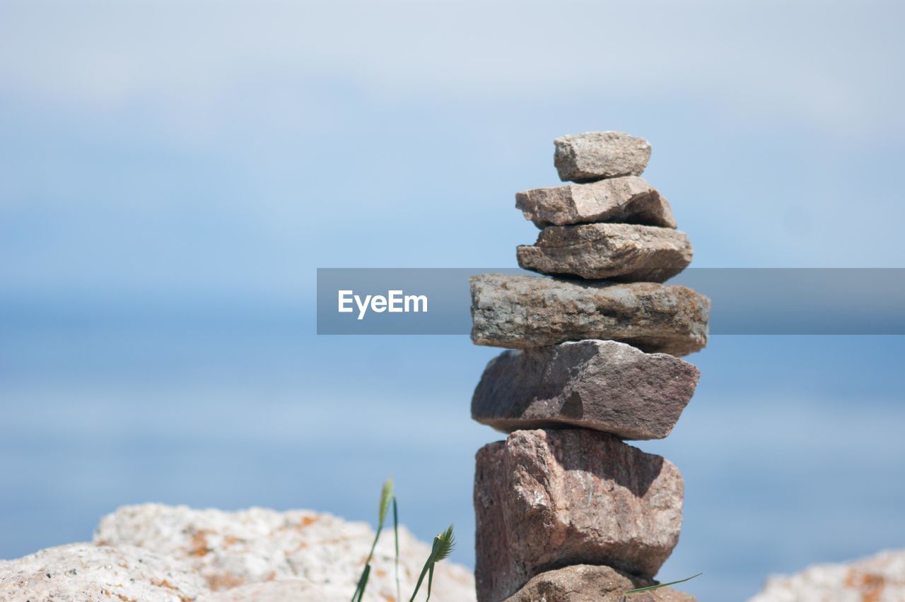 STACK OF PEBBLES ON SEA SHORE