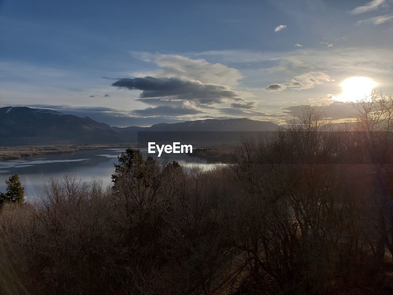 SCENIC VIEW OF SUNSET OVER LAKE