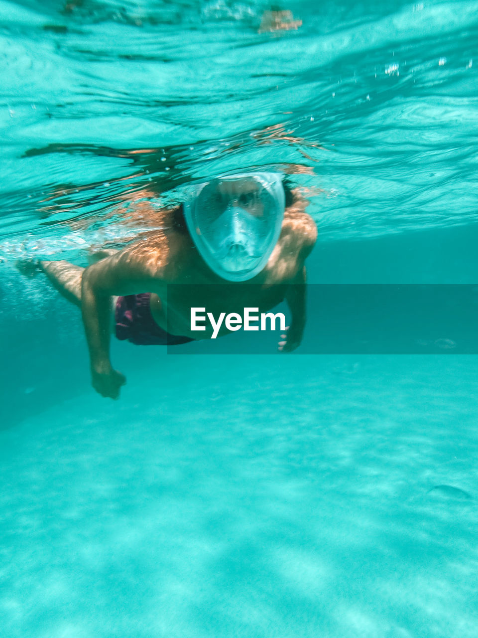 Man swimming in pool