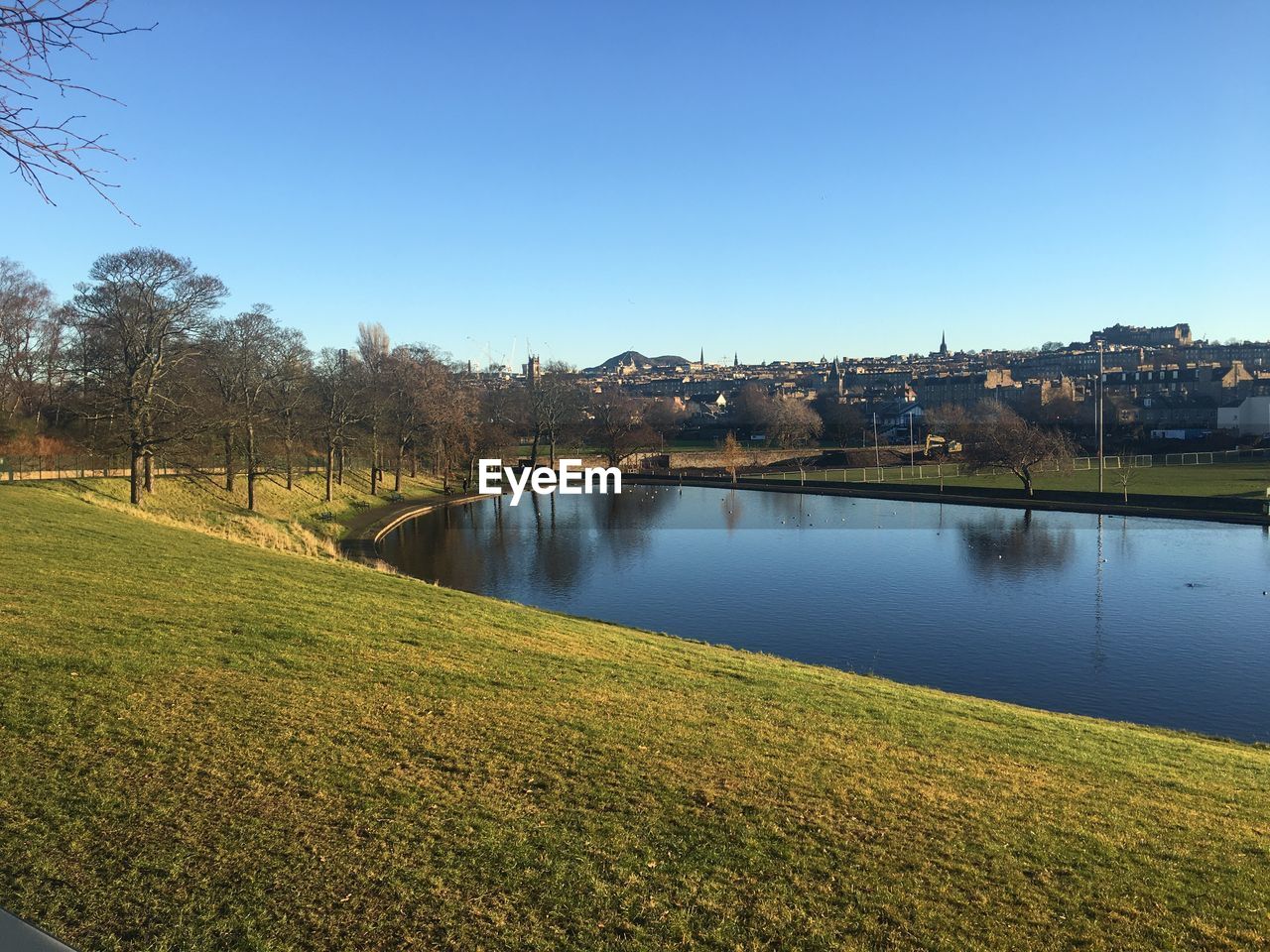 Scenic view of river against clear sky