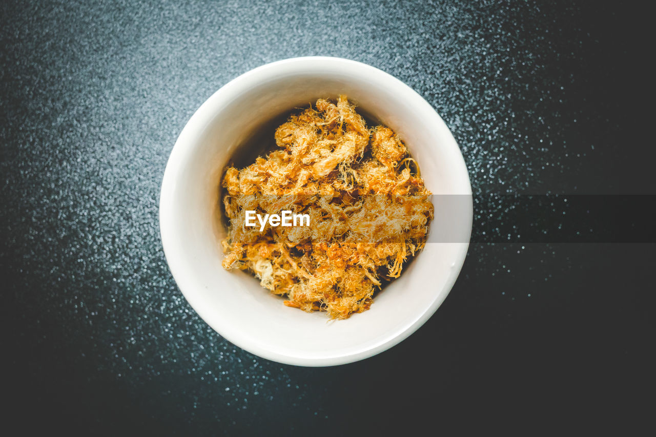 High angle view of food in bowl over black background