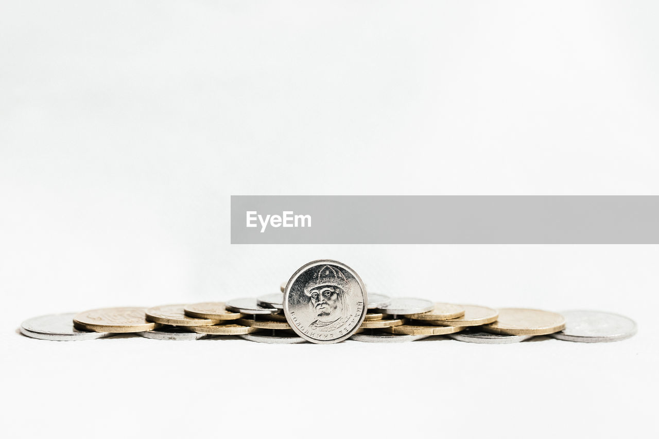 Close-up of coins on white background