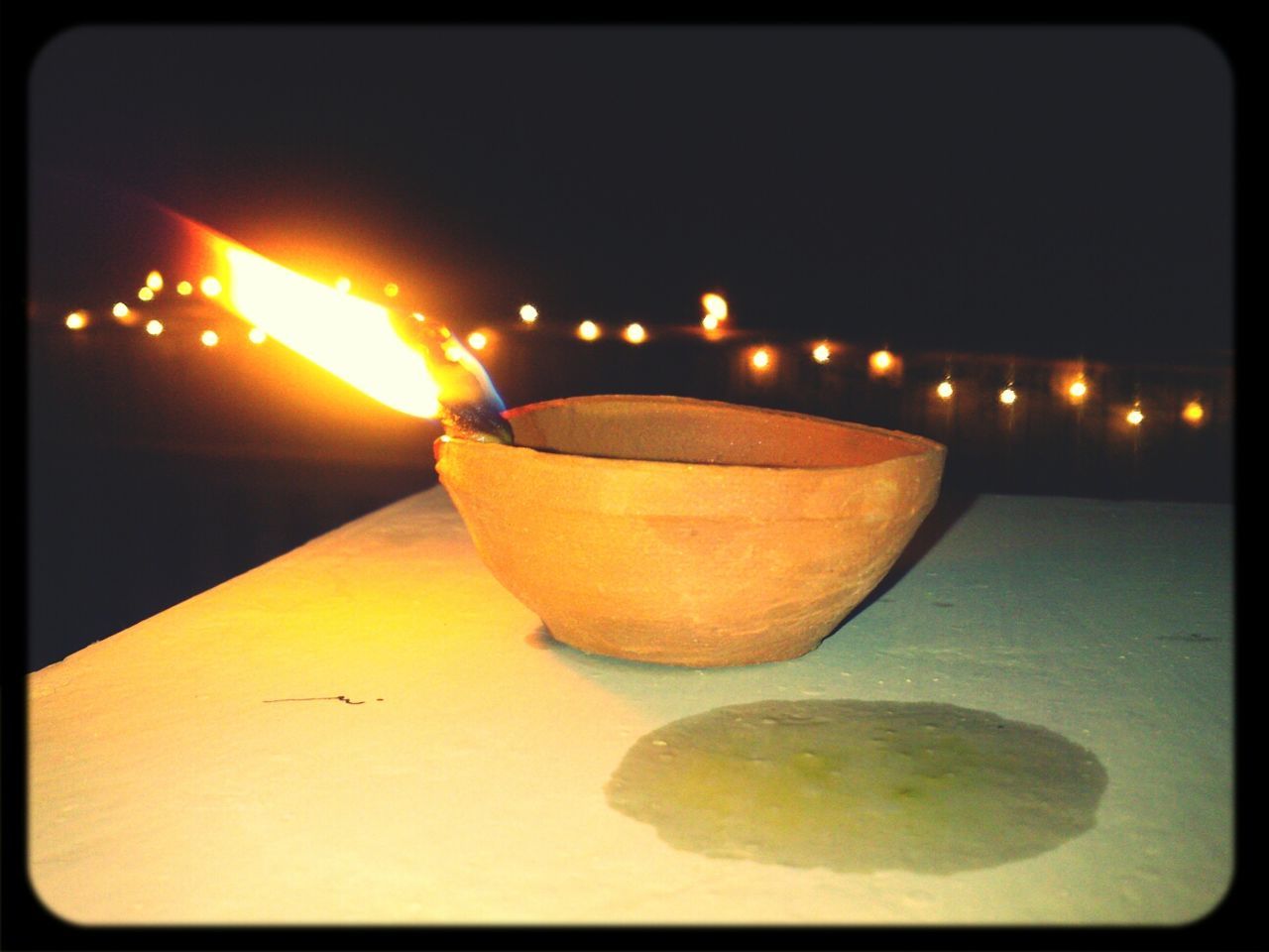 Close-up of diwali oil lamp burning