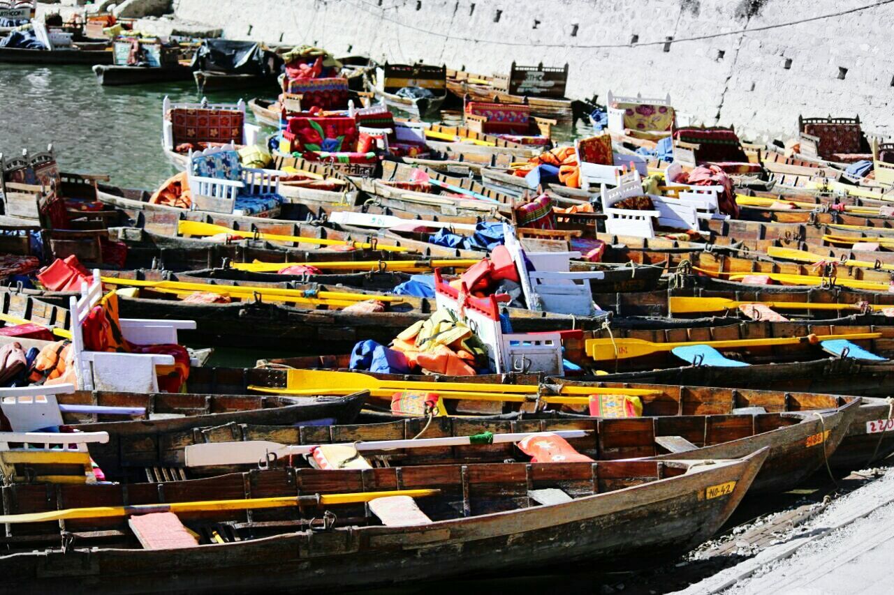 High angle view of boats moored at riverbank