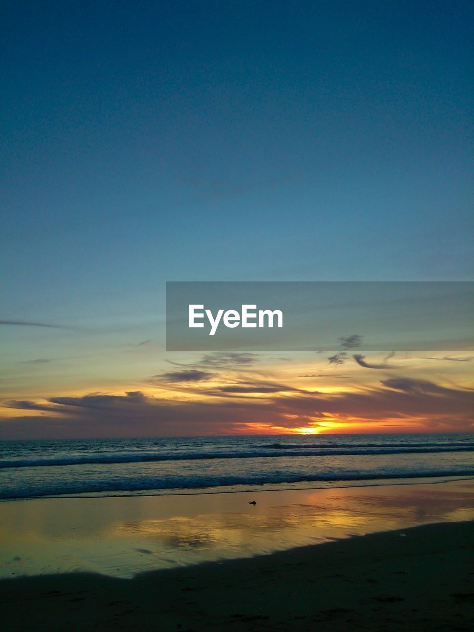 View of beach at sunset