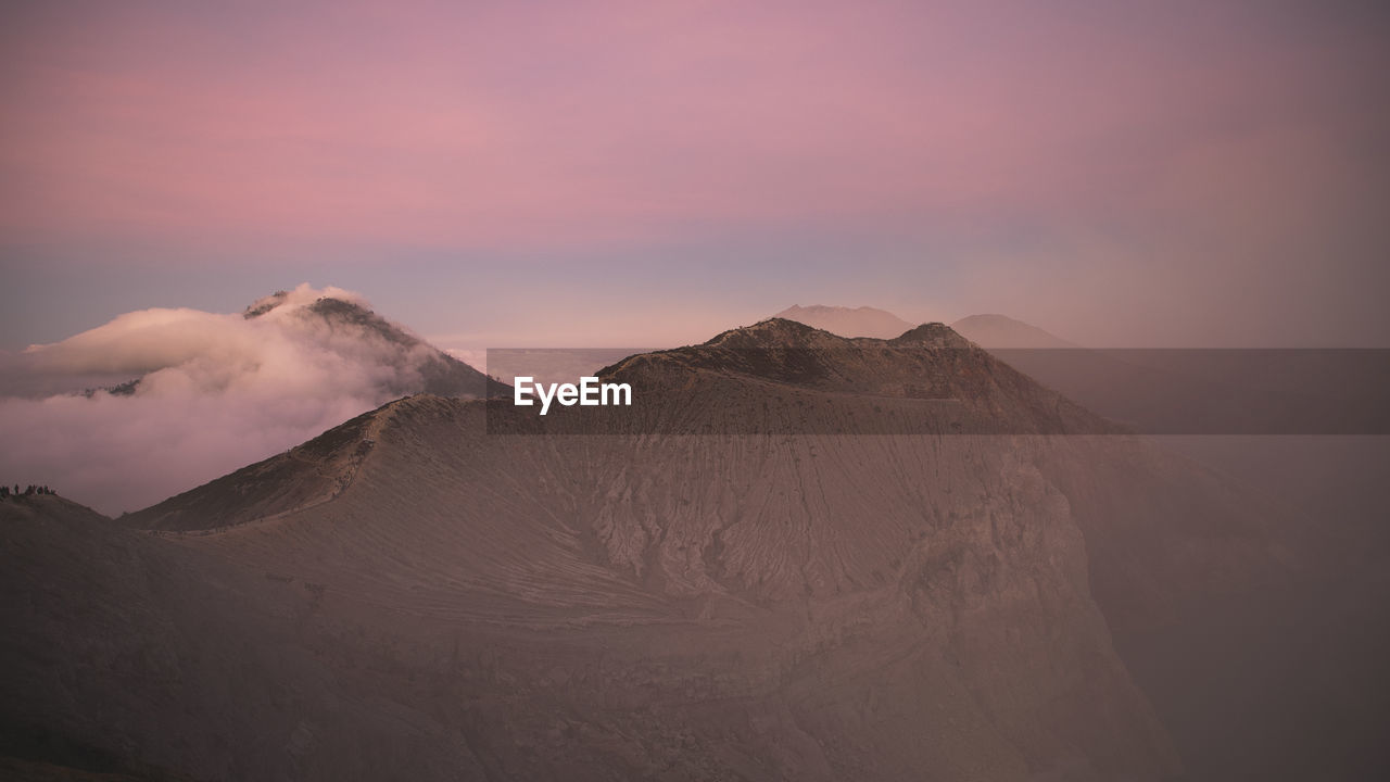 Scenic view of mountains against sky during sunset