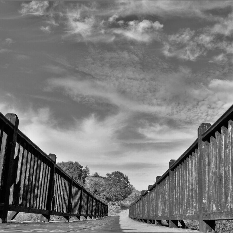 VIEW OF EMPTY ROAD AGAINST CLOUDY SKY