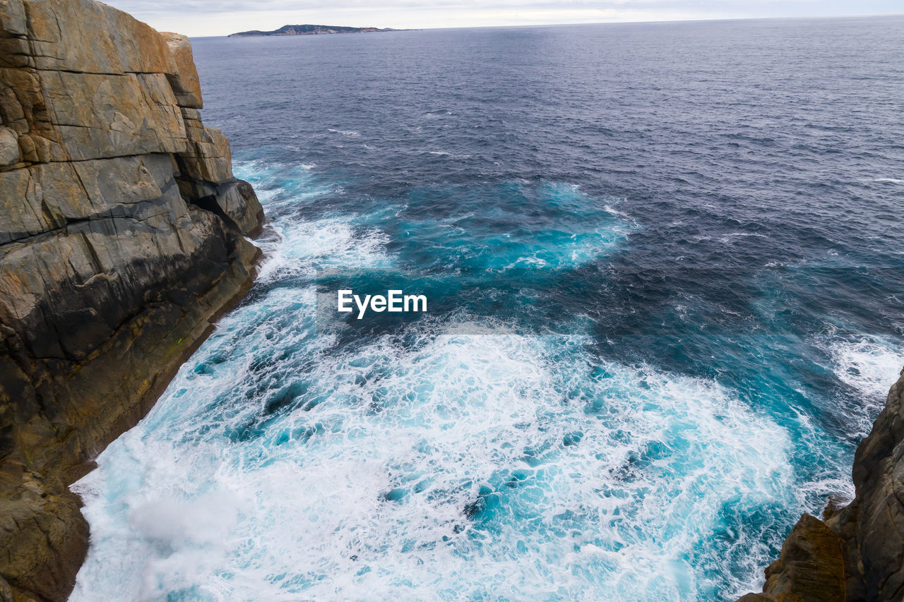 High angle view of rock formation in sea