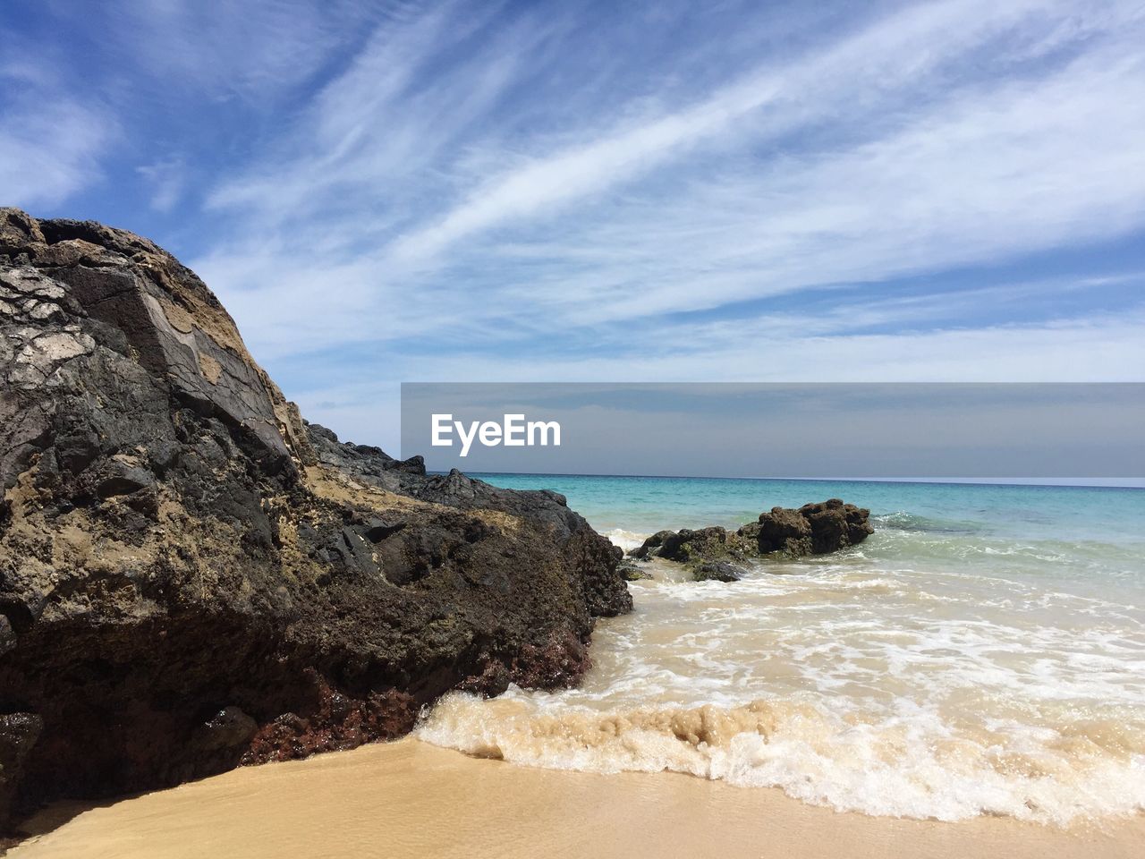 Scenic view of beach against sky