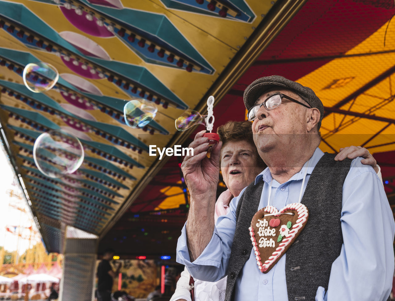 Senior couple having fun together on fair