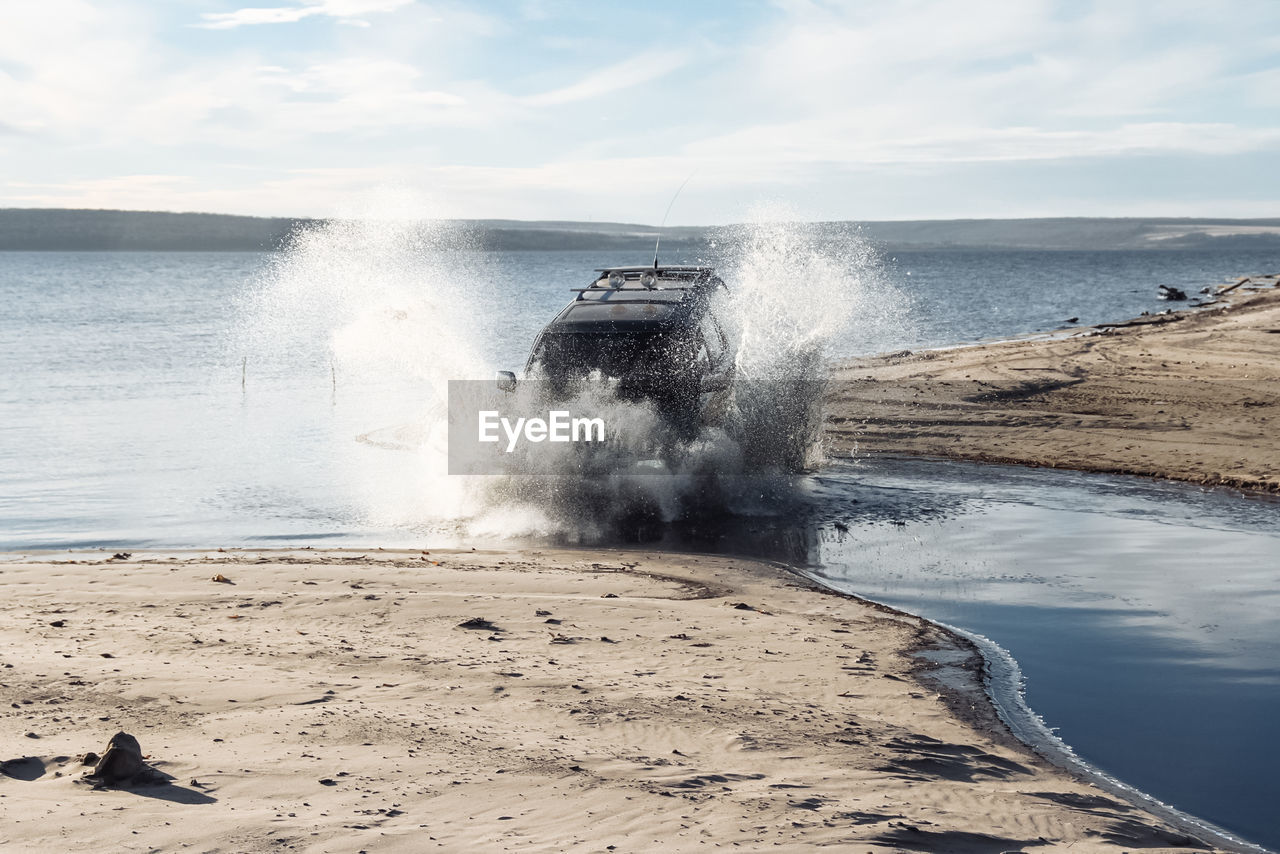 Suv dives into the water, fords the river