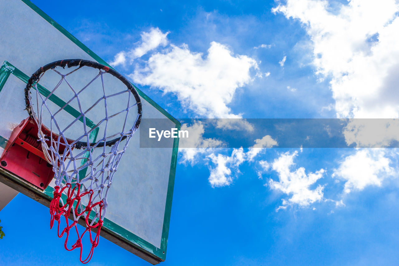 LOW ANGLE VIEW OF FERRIS WHEEL AGAINST BLUE SKY