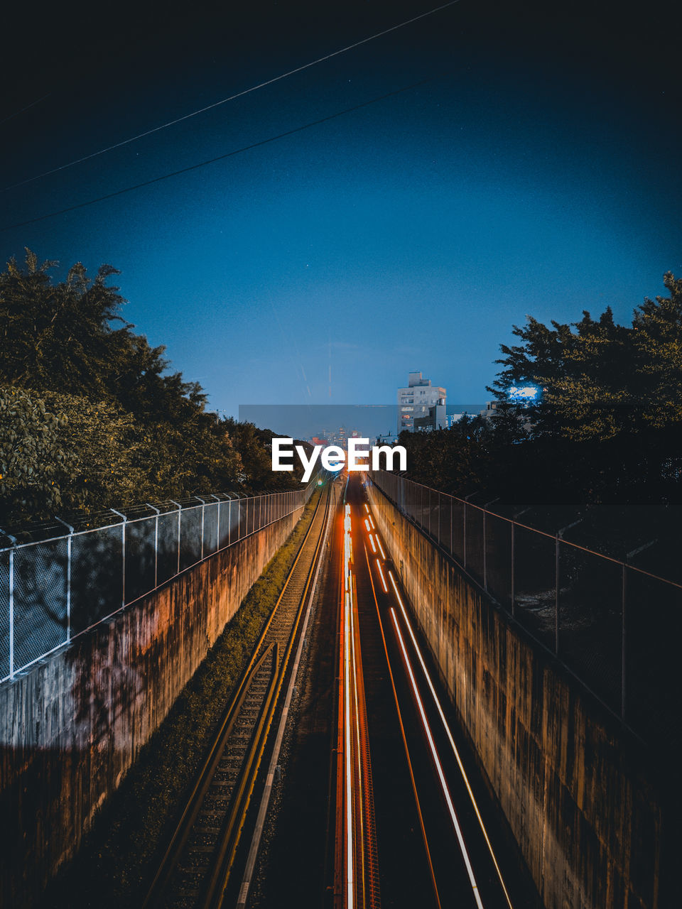 High angle view of light trails on road at night