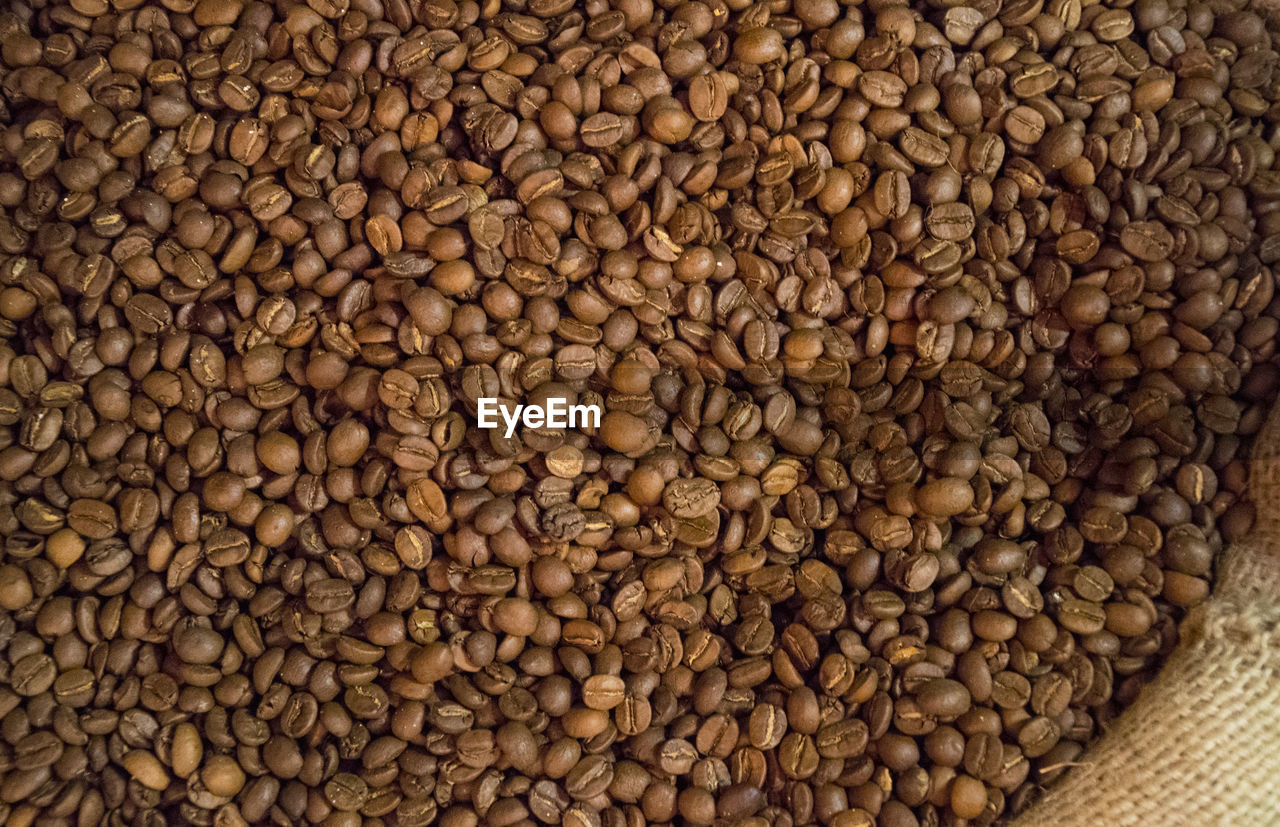 FULL FRAME SHOT OF COFFEE BEANS IN CONTAINER