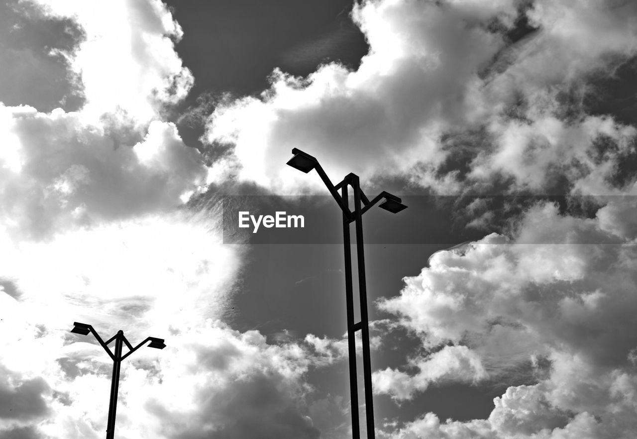 cloud, sky, street light, black and white, lighting equipment, low angle view, street, monochrome photography, monochrome, nature, no people, outdoors, cloudscape, wind, day, silhouette, light