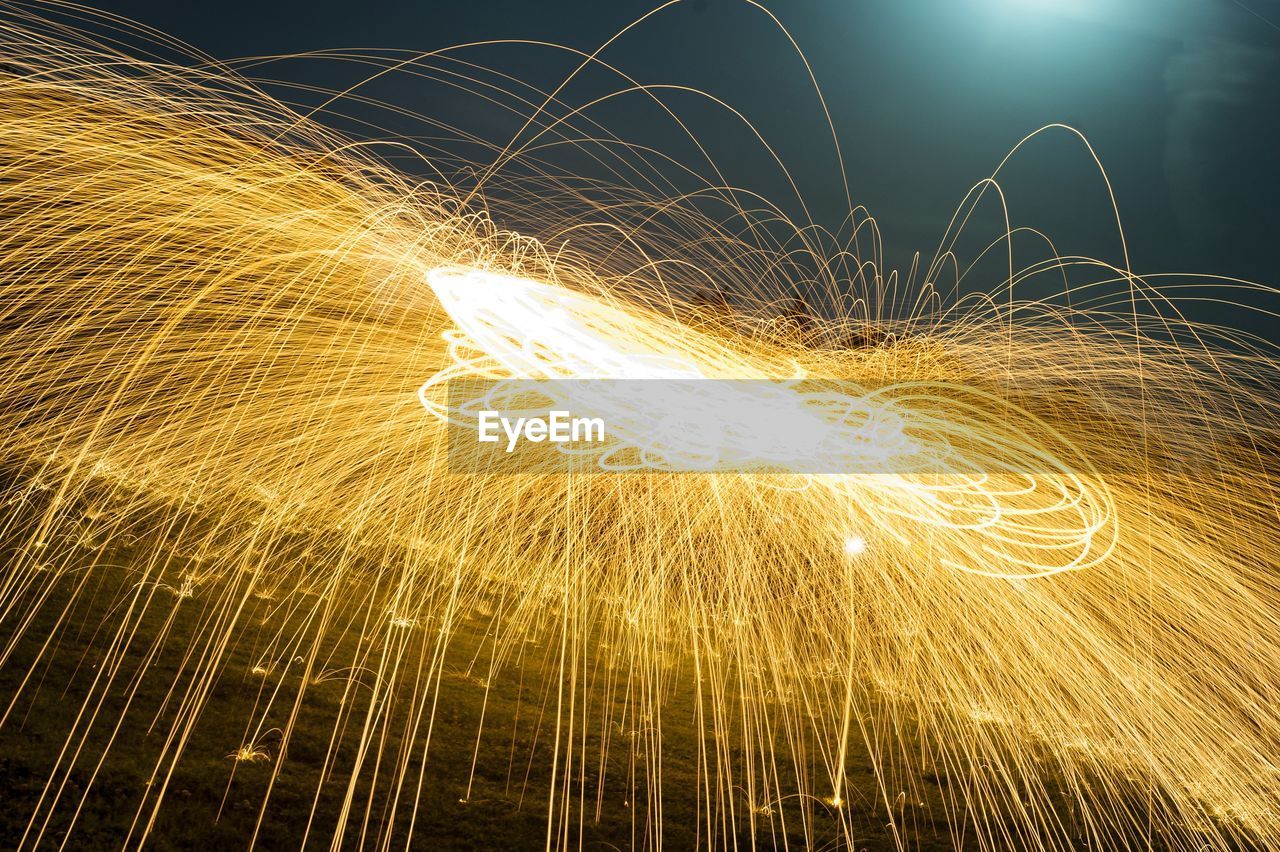 Wire wool spinning over field at night