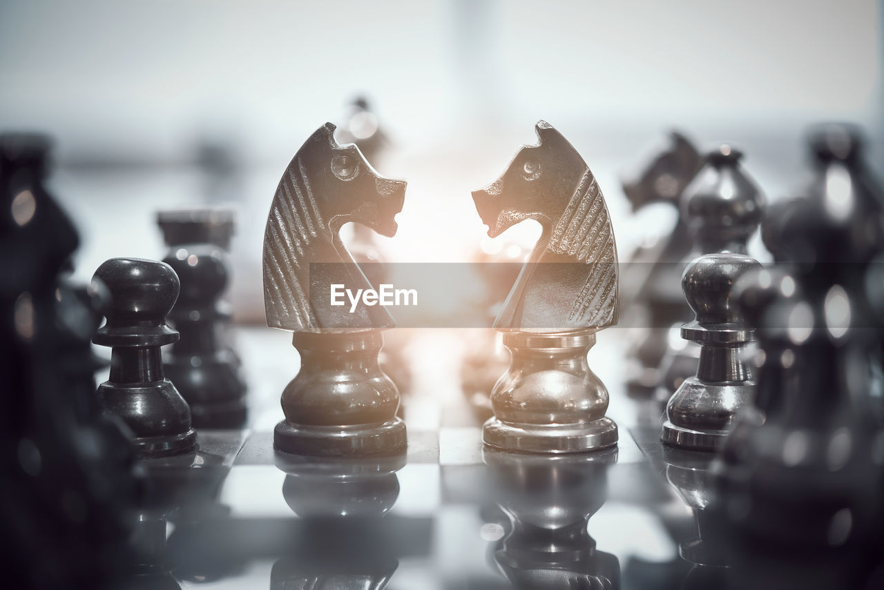 Close-up of chess pieces on board