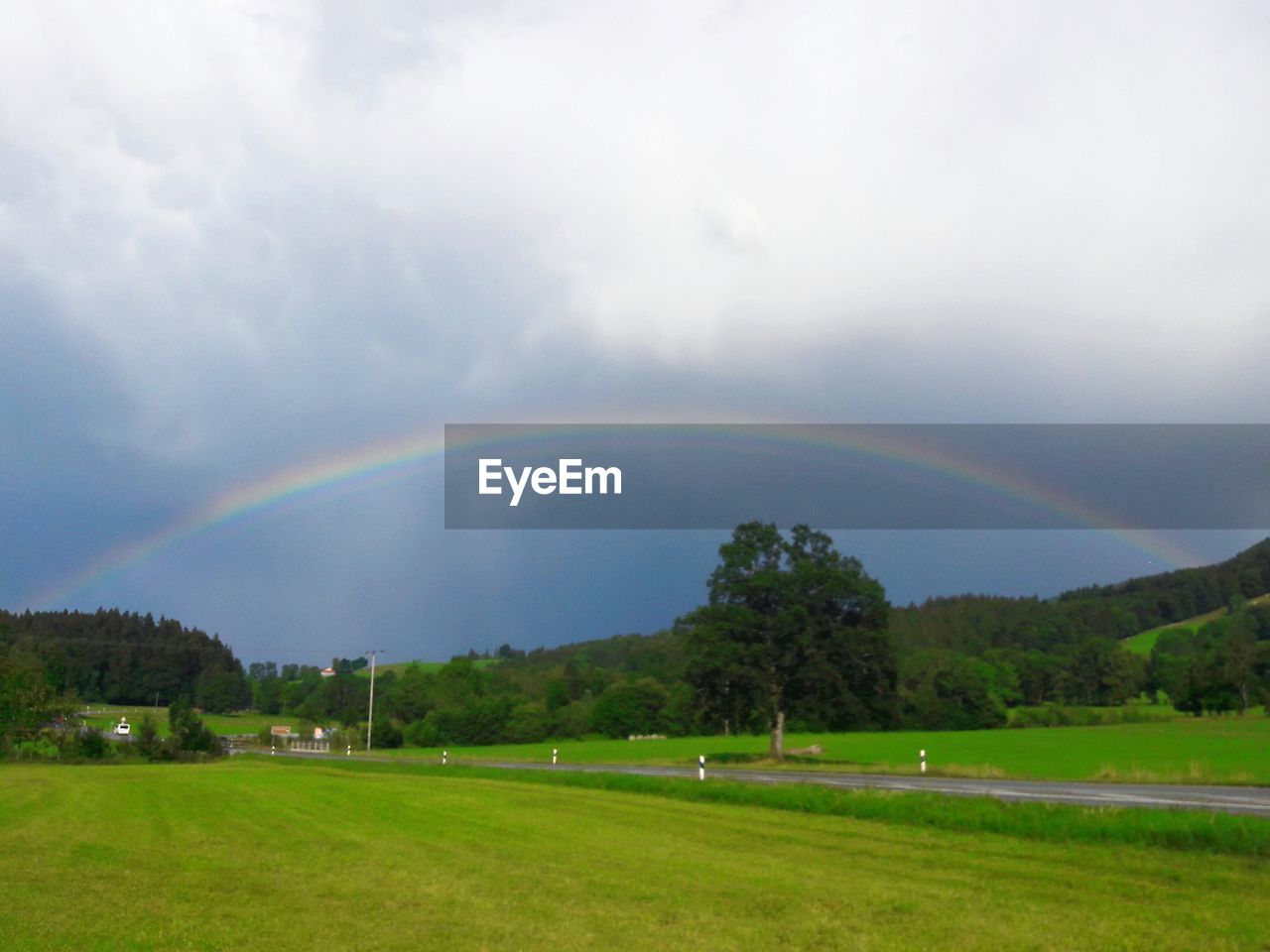 SCENIC VIEW OF RAINBOW OVER LAND