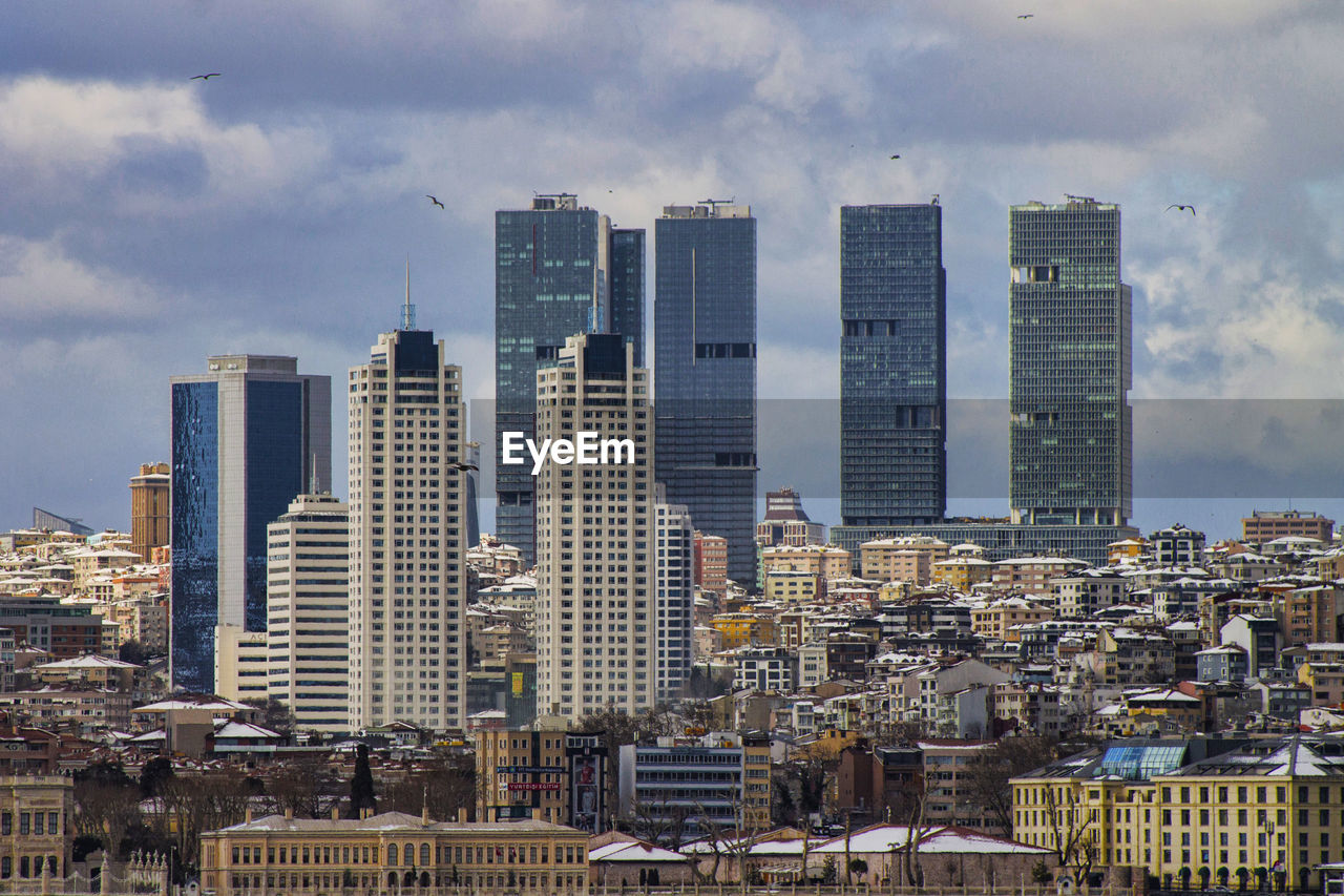 Modern buildings in city against sky