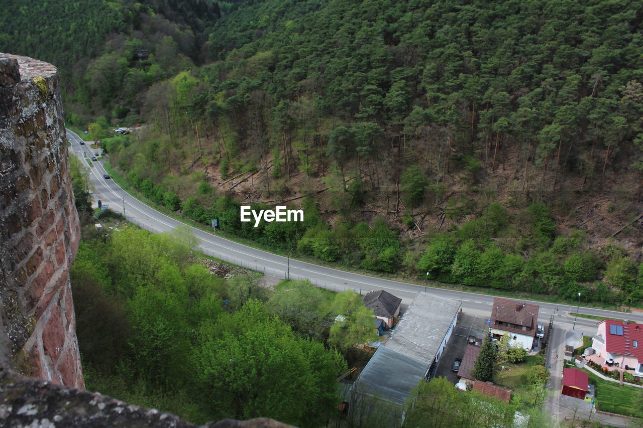 High angle view of road amidst trees and mountains