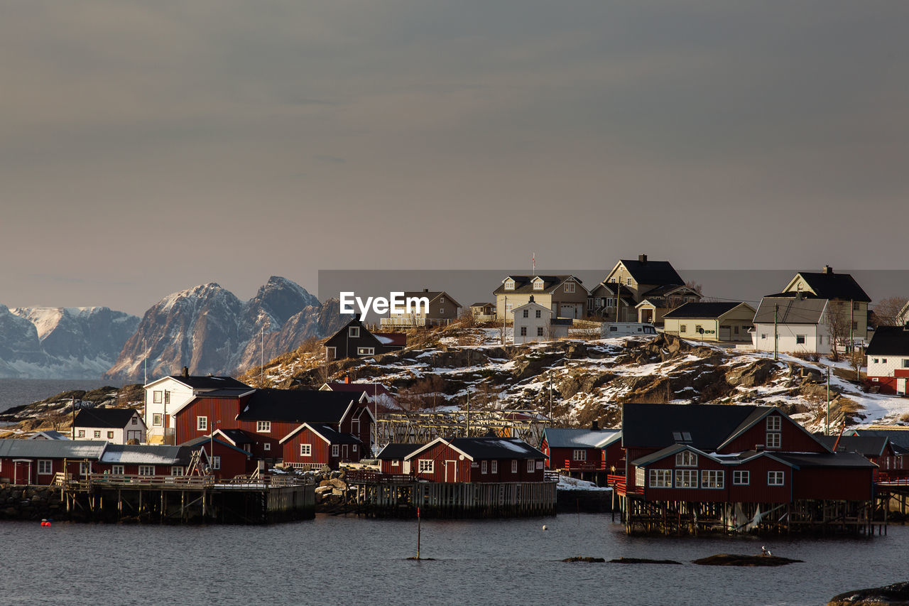 Scenic view of sea and buildings against sky