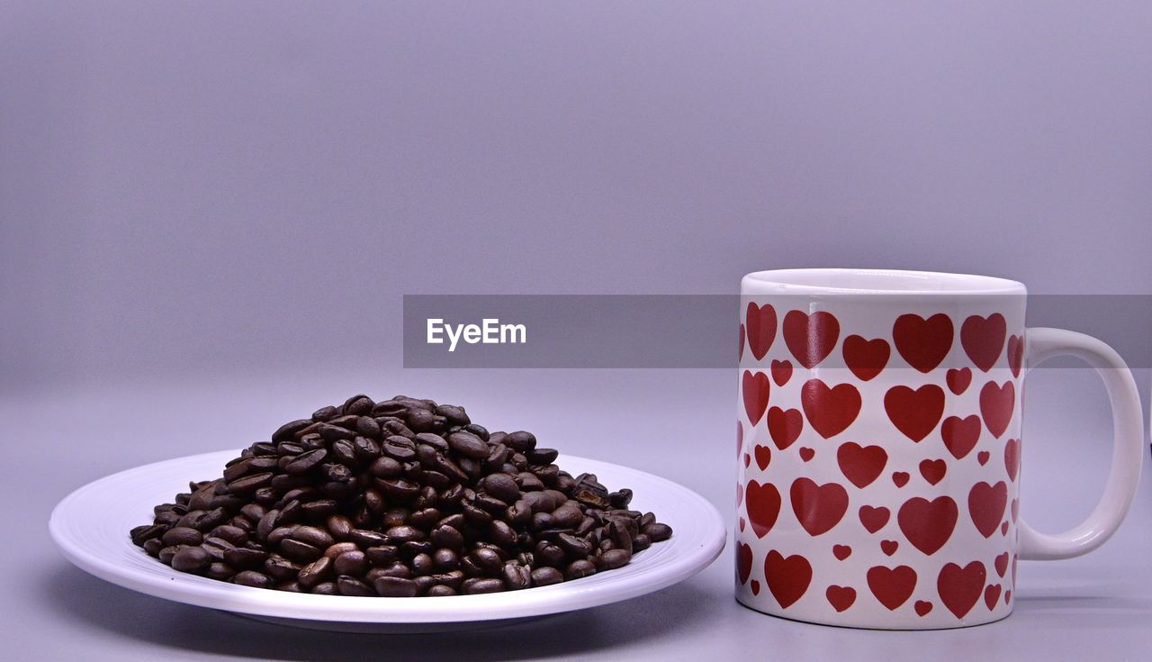 Close-up of coffee cup on table