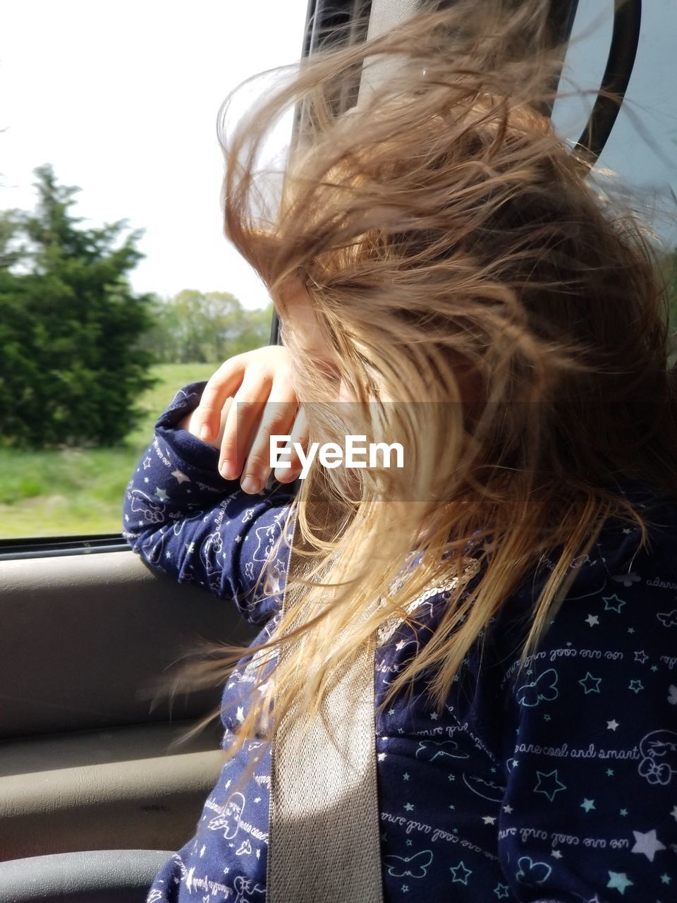 Girl sitting in car