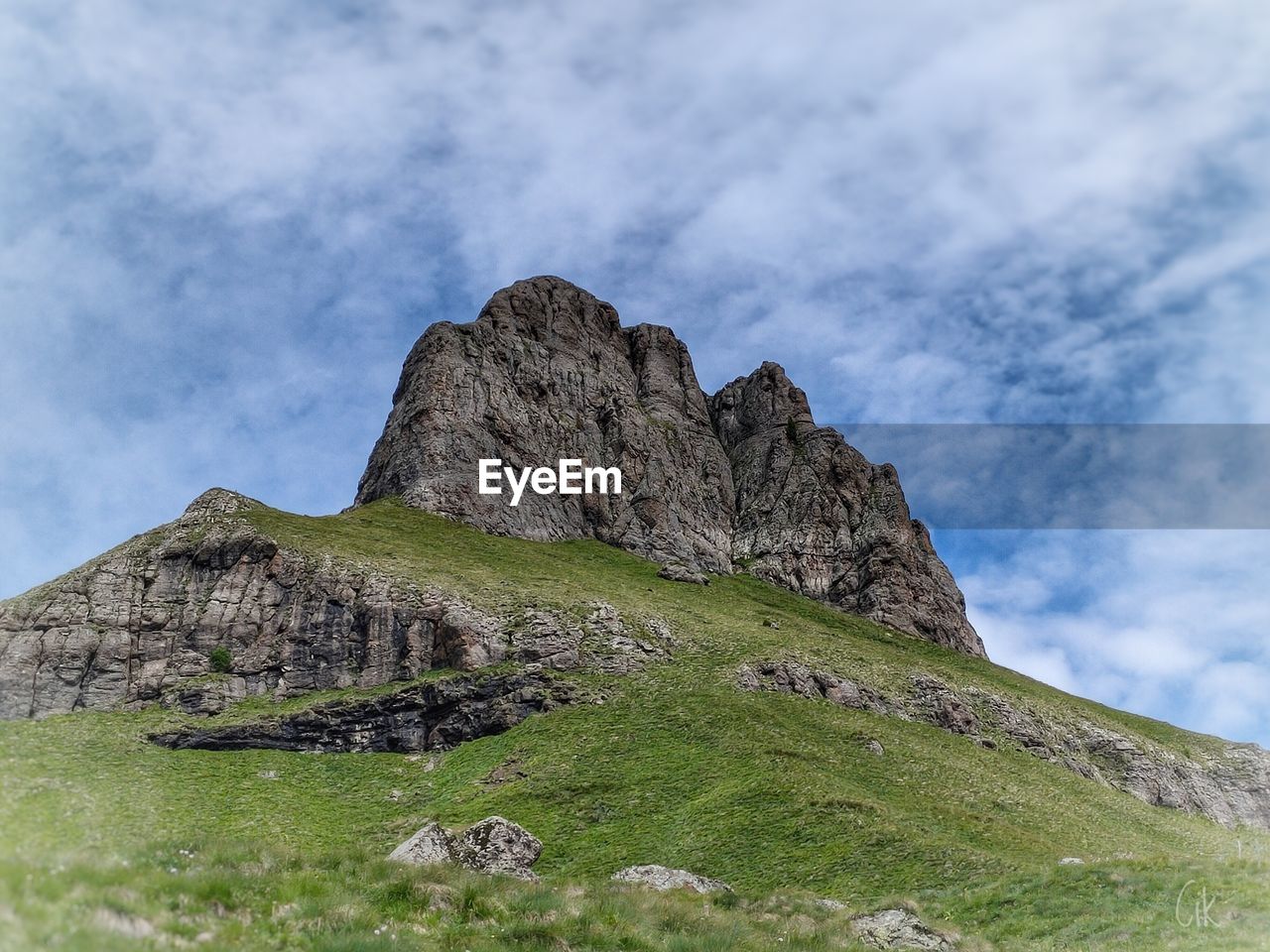 Low angle view of rock formations against sky