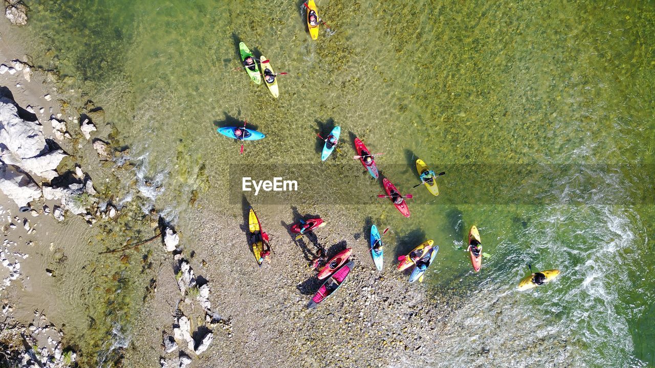 High angle view of people kayaking in river