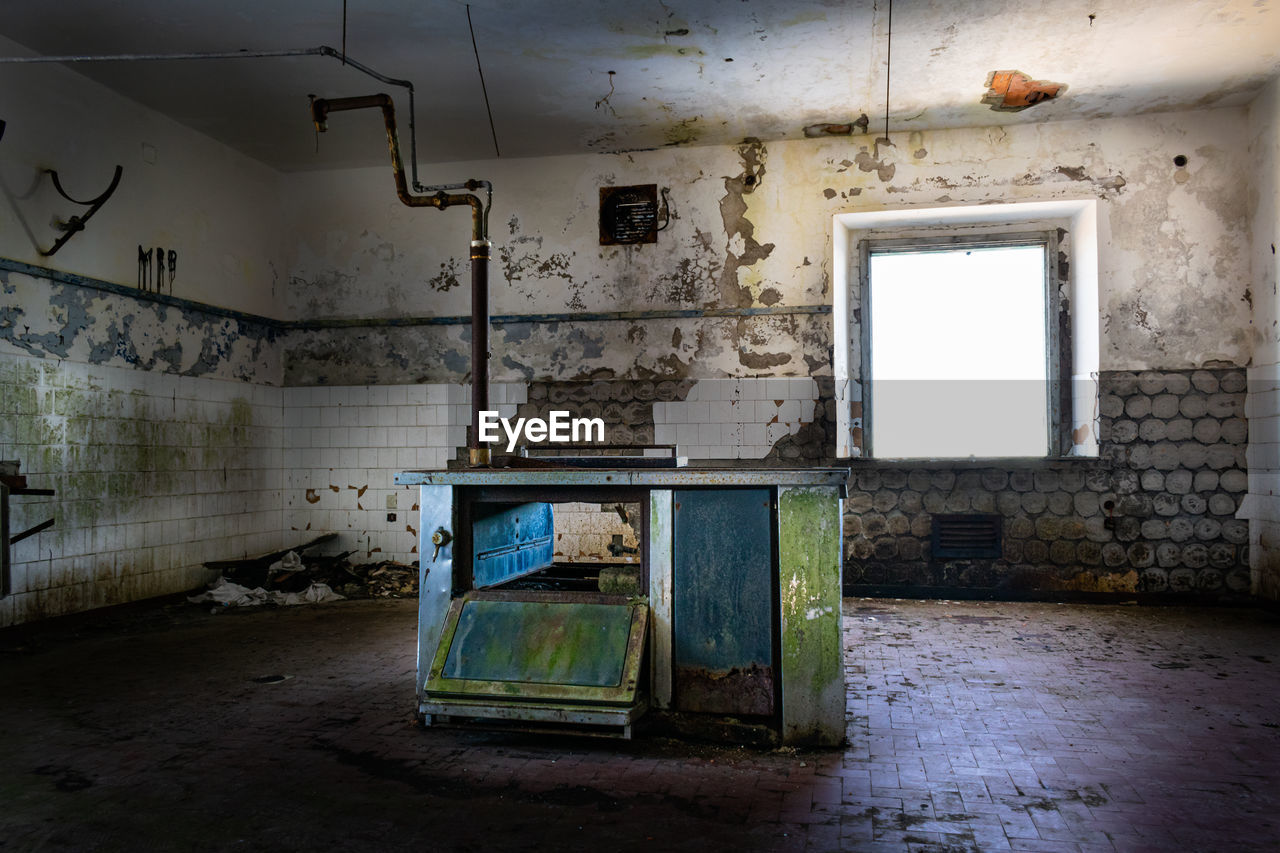 Interior of abandoned building. looted kitchen