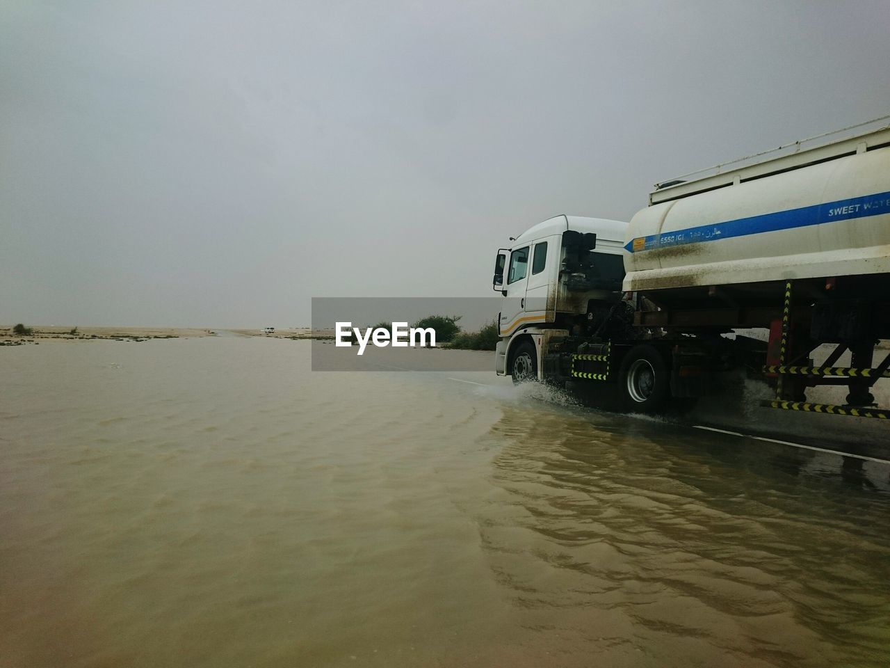 WET BEACH AGAINST SKY