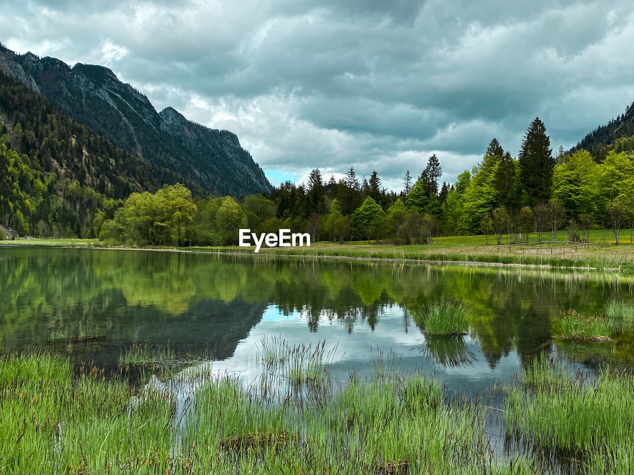 Scenic view of bavarian lake at dreiseengebiet, chiemgau, against sky