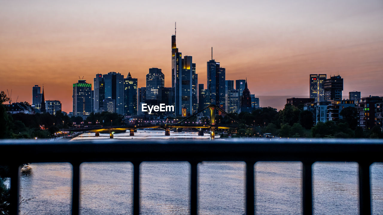 View of buildings in city at sunset