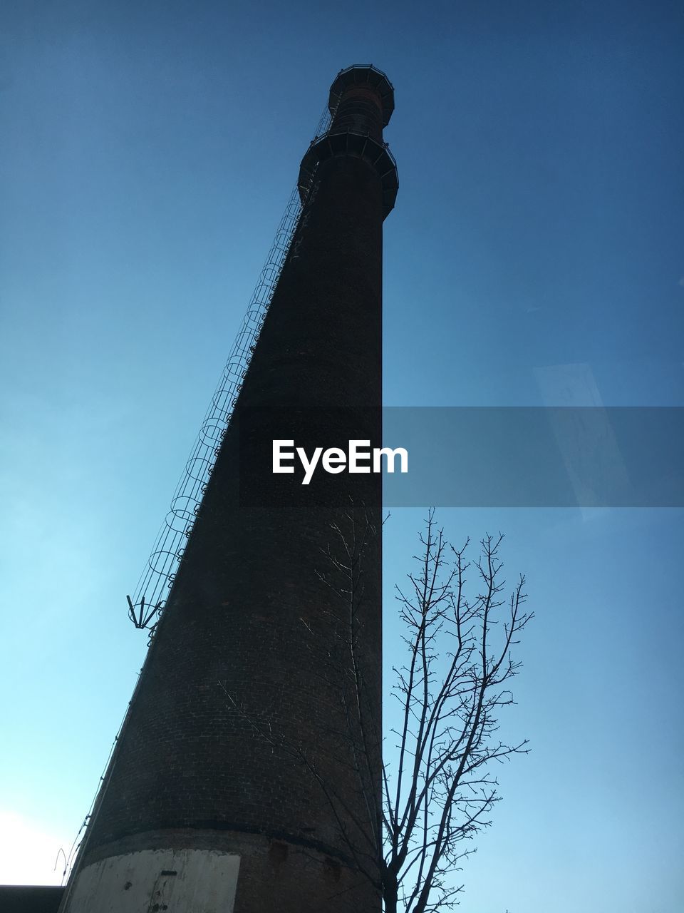 LOW ANGLE VIEW OF BUILT STRUCTURES AGAINST BLUE SKY